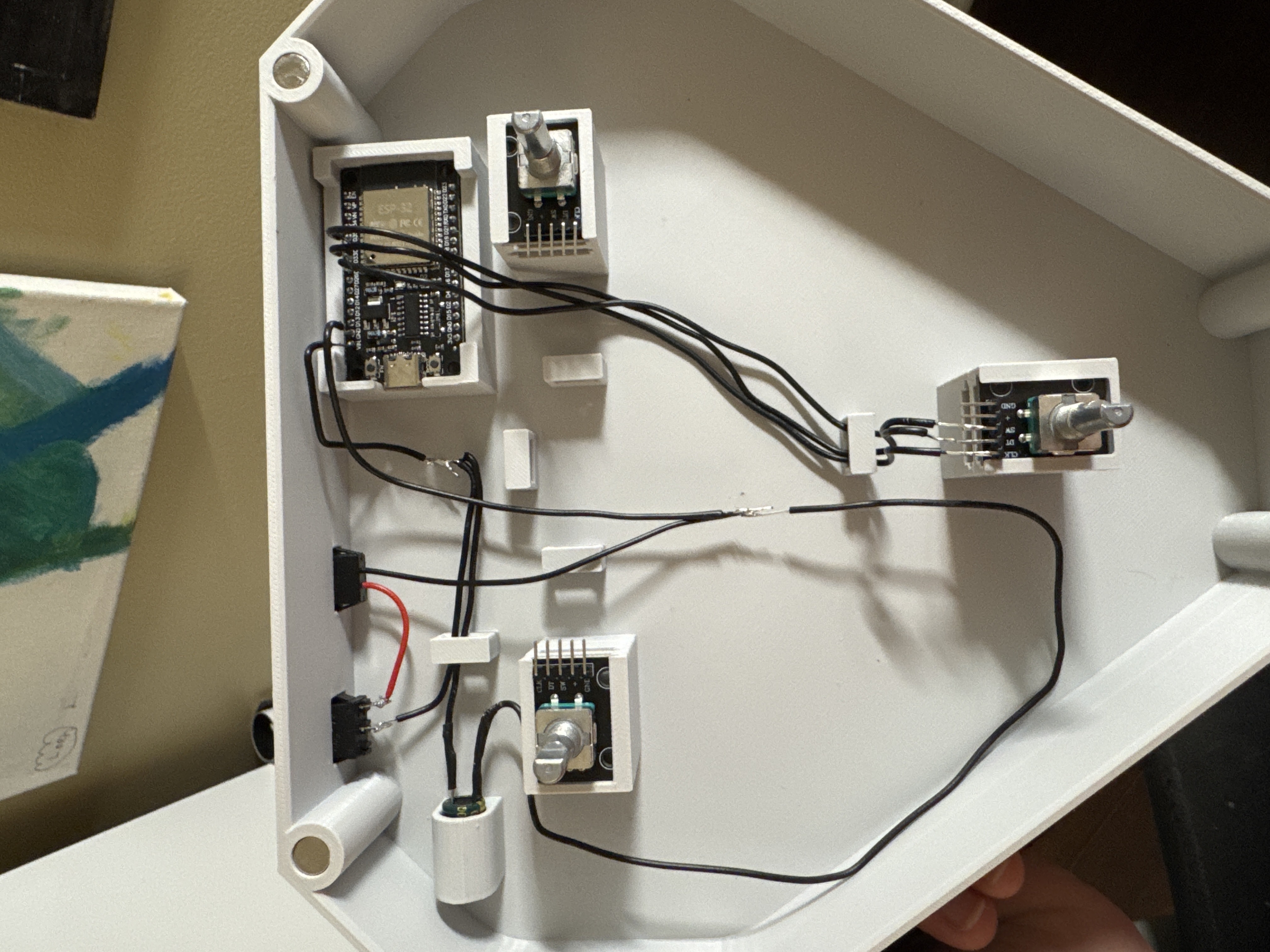 First half of the soldering process, soldering the rocker switch, Type-C port, capacitor, one of the rotary encoders, and the ESP32 to the common PWR and GND 'rails'.